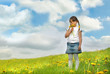 Foto: Little girl with pigtails holding dandelions Little girl with pigtails holding dandelions