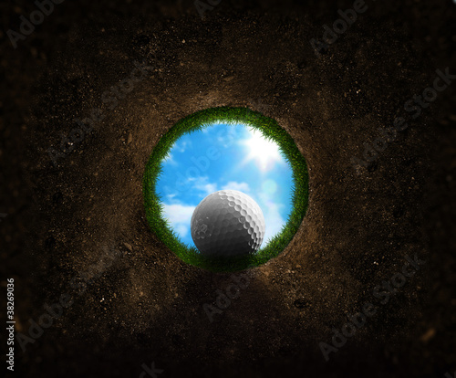 Photo: Golf ball falling into the cup Golf ball falling into the cup
