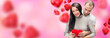 Beautiful young couple embracing and looking at camera. Standing