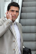Young man with cellphone outdoors