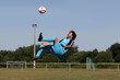 Footballer kicking ball