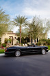 Luxurious open roof car parked outside villa
