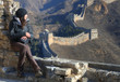 Beautiful girl standing on the Great Wall of China - Simatai