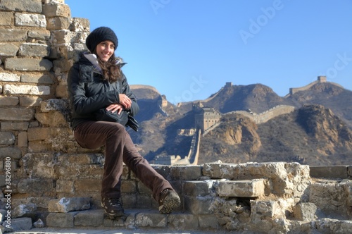 Photo: Beautiful girl standing on the Great Wall of China - Simatai Beautiful girl standing on the Great Wall of China - Simatai