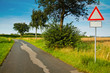 Foto: country road with caution sign country road with caution sign