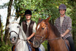 Young people horseriding
