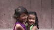 Video: happy little Asian girl hugging female baby happy little Asian girl hugging female baby