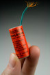 Large Firecracker in Hand - Burning Fuse