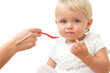 Portrait of blue eye baby girl with hand and spoon