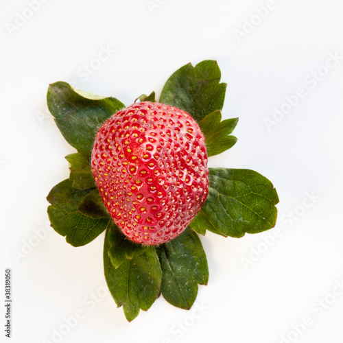 Photo: Strawberry from Above with Green Leaves Strawberry from Above with Green Leaves