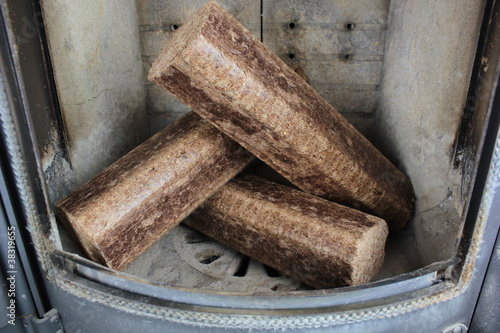 Photo: Hard wood briquettes in stove Hard wood briquettes in stove