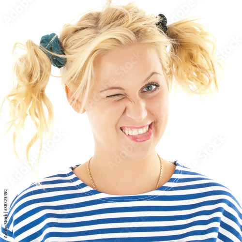 Photo: Woman with a funny look on her face smiles Woman with a funny look on her face smiles