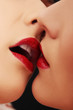 Closeup of pair women mouths kissing