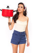Photo: Beautiful young woman holding cooking pot Beautiful young woman holding cooking pot
