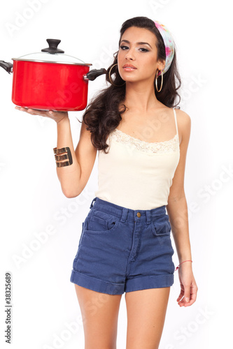 Photo: Beautiful young woman holding cooking pot Beautiful young woman holding cooking pot