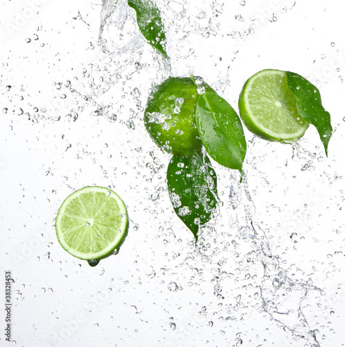 Photo: Green limes with splashing water Green limes with splashing water