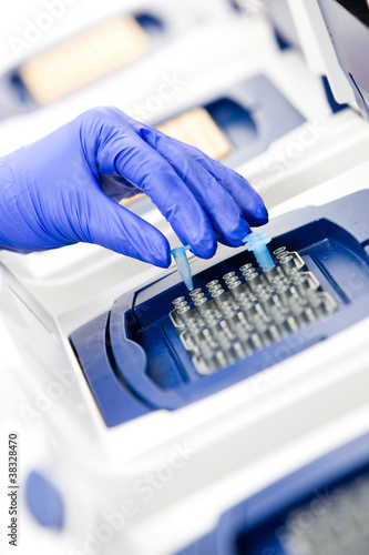 Photo: Scientist with DNA copying, Real-time cycler angle Scientist with DNA copying, Real-time cycler angle