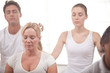 Group of people meditating at the yoga center