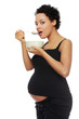 Pregnant woman eating healthy food.