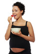 Pregnant woman eating healthy food.