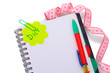 Planning of diet. Notebook measuring tape and pencil isolated