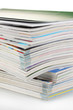 Stack of magazines isolated on white
