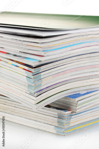 Photo: Stack of magazines isolated on white Stack of magazines isolated on white