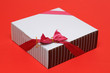 Cube box of chocolate on red