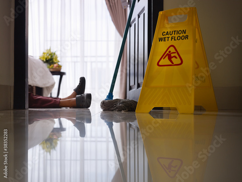 Photo: maid slipped on wet floor and laying down maid slipped on wet floor and laying down