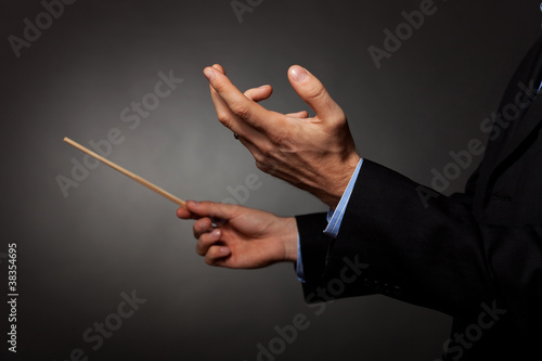 Photo: male music conductor directing male music conductor directing