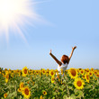 redhaired woman in sunflower field