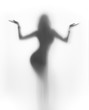 Beautuful dancer woman holds her hand up as scales