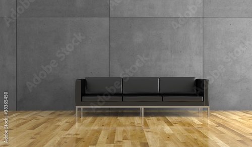 Photo: Wohndesign - schwarzes Ledersofa vor Betonwand Wohndesign - schwarzes Ledersofa vor Betonwand