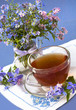 Photo: bunch in a jar and tea in cup glass bunch in a jar and tea in cup glass