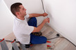 Electrician wiring a home