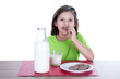 little girl drinking milk and cookies