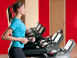 Photo: Gym exercising. Run on on a machine. Gym exercising. Run on on a machine.
