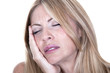 blonde woman in pain is having toothache