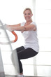 Mature woman working out at the gym