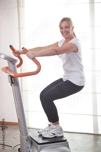 Photo: Happy woman ath the gym Happy woman ath the gym