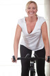 Woman spinning at the gym