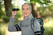 Grey haired man with binoculars