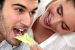 woman giving her boyfriend a salad