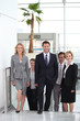 Businesspeople walking through an airport