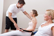 Women exercising with instructor help