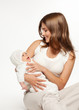 Happy mother playing with baby