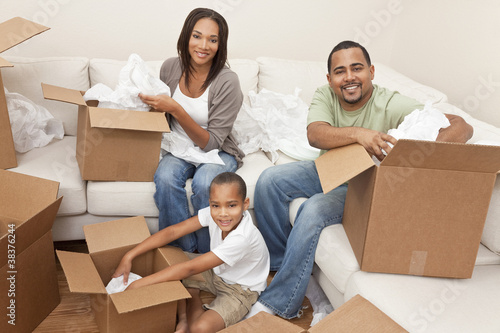 Photo: African American Family Unpacking Boxes Moving House African American Family Unpacking Boxes Moving House