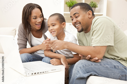 Photo: African American Family Using Laptop Computer African American Family Using Laptop Computer