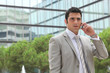 Businessman outdoors talking on phone