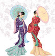 Two beautiful Chinese women with umbrellas